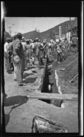 Workers attempt to rescue John M. Burns, Robert Rosenthal, and Bernard Glennin after a cave-in, Los Angeles, 1937