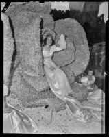 Queen Barbara Dougall rides her float in the Tournament of Roses Parade, Pasadena, 1939