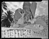 Queen Barbara Dougall rides her float in the Tournament of Roses Parade, Pasadena, 1939