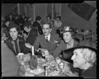 Alfredo Ramos Martinez, his wife, Maria de Sodi Romero and Mrs. George W. Wallace at a restaurant, Los Angeles, 1939