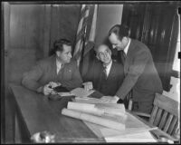 Howard Stites, E. J. Jackson and Walter Hinton discuss city council matters, Burbank, 1938
