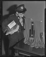 Postal Telegraph messenger, Leo Cardioty, shops for ladies' hosiery, Los Angeles, 1938