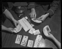 Bridge game joined by Postal Telegraph messenger, Boyce Herrod, viewed from above, Los Angeles, 1938