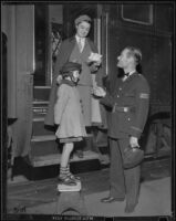 Postal Telegraph messenger, Dick Courtway, picks up Barbara Jean Goodall from her train, Los Angeles vicinity, 1938
