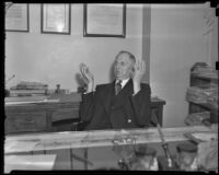 Felix B. Janofsky, Czech consul, seated at his desk, Los Angeles, 1939
