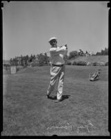 Guy Hanson showing his follow through on a golf course, 1939