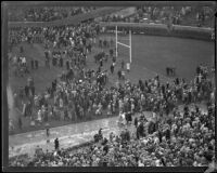 Crowds spill onto the field during the Rose Bowl game between Stanford and Columbia, Pasadena, circa 1934