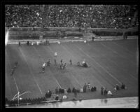 Players scramble for a fumbled ball during the Rose Bowl game between Stanford and Columbia, Pasadena, circa 1934