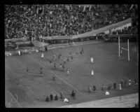 Players run towards the end zone during the Rose Bowl game between Stanford and Columbia, Pasadena, circa 1934