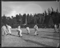 Stanford football players run through drills during practice, Pasadena, circa 1934