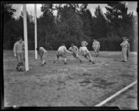 Stanford football team practices a play prior to the Rose Bowl game, Pasadena, circa 1934