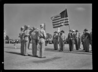 Banker Harold C. Schaffer presents colors to Foothill Regiment, Santa Anita, 1941