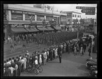 Crowds watch military units march in Armistice Day parade, San Diego, 1941