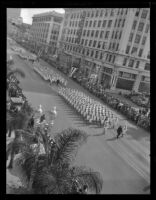 Crowds watch military units march in Armistice Day parade, San Diego, 1941