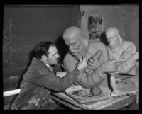 Alexander Archipenko works on a clay bust of the Ukranian poet Taras Shevchenko, Los Angeles, 1935