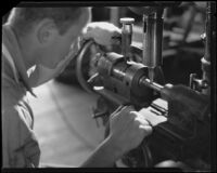 Technician making a brass horn at the F. E. Olds and Son plant, Los Angeles, 1933-1939