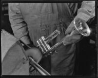 Technician polishing a trumpet at the F. E. Olds and Son plant, Los Angeles, 1933-1939