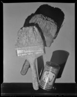Dirty paint brushes in an advertisement photograph for Savabrush, 1925-1939