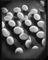 Photomontage created with repeated images eggs on a table, 1925-1939