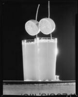 Glasses of a beverage with lemon slice ornaments for a Sunkist advertisement