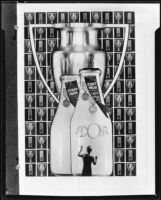 Woman facing 2 giant award-winning bottles of Adohr milk