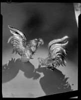 Pair of brass fighting roosters at the Brock & Company jewelry and gift store, Los Angeles, 1930