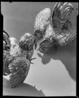 Pair of brass fighting roosters at the Brock & Company jewelry and gift store, Los Angeles, 1930