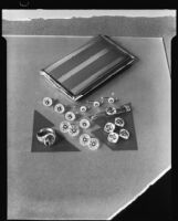 Ring, cuff links, tie clip and cigarette case at the Brock & Company jewelry and gift store, Los Angeles, 1930