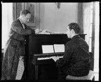 Ted Koehler and Harold Arlen working on a song at a piano at the Ambassador Hotel, Los Angeles, circa 1933