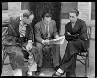 Ted Koehler, lyricist, and Harold Arlen, composer, discuss their song "Let's Fall in Love" with Felix Young, producer, at the Ambassador Hotel, Los Angeles, circa 1933