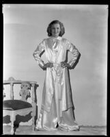 Evalyn Knapp, actress, modeling a satin outfit, circa 1932-1934