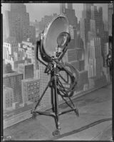 Laco stage light on a tripod in front of a painted backdrop at Columbia Pictures Studio, Los Angeles, 1926-1939