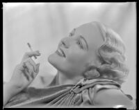 Virginia Pine, actress, holding a cigarette, circa 1934-1935