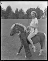 Inez Courtney, actress, riding a pony and holding a golf club, circa 1934-1939