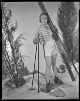 Inez Courtney, actress, wearing snowshoes and holding skis, circa 1934-1939