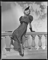 Joan Perry, actress, modeling a dress, circa 1935-1939