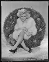 Barbara Pepper, actress, sitting on a wreath, circa 1938-1939