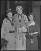 May Robson, actress, standing between two women in front of a train, circa 1933-1937