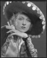 Dorothy Revier, actress, wearing a Spanish hat and embroidered jacket, circa 1925-1934