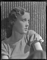 Half-length portrait of a woman looking off to her left, circa 1926-1939