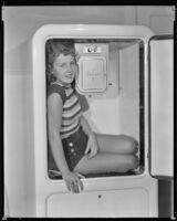 Barbara Read, actress, sitting in a Grunow refrigerator, circa 1934-1936