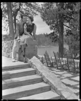 Johnny Mack Brown, actor, sitting next to a woman, Lake Arrowhead, circa 1929-1934