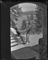 Johnny Mack Brown, actor, holding the hands of a woman, Lake Arrowhead, circa 1929-1934