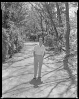 Man walking down a dirt path, circa 1932-1939
