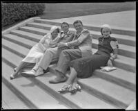 Woman, man, Lyle Talbot, actor, and another woman sitting on steps that may be on the grounds of the Hotel Del Monte, circa 1932-1939