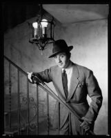 Fred Keating, actor, on a stairway in his Hollywood Hills house "Casa Escrow," Los Angeles, circa 1934