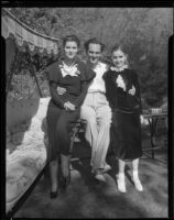 Joseph Schildkraut, actor, with his arms around a woman and a girl, circa 1934