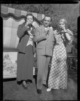 Woman and a man posing with Marie Schildkraut, circa 1934