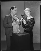Joseph Schildkraut, actor, posing with his wife and two dogs, circa 1934