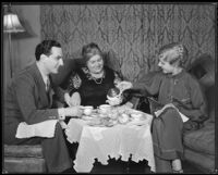 Joseph Schildkraut, actor, drinking tea with his mother, Erna, and his wife, Marie, circa 1934